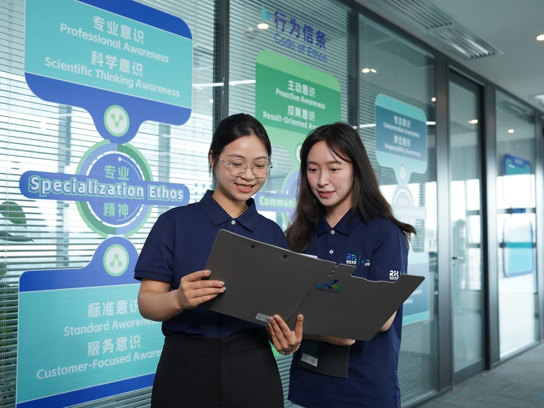 Rongtao Medical quality team reviewing documentation at the Guangzhou repair headquarters